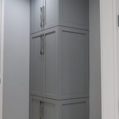 Built-in grey cabinetry along a wall